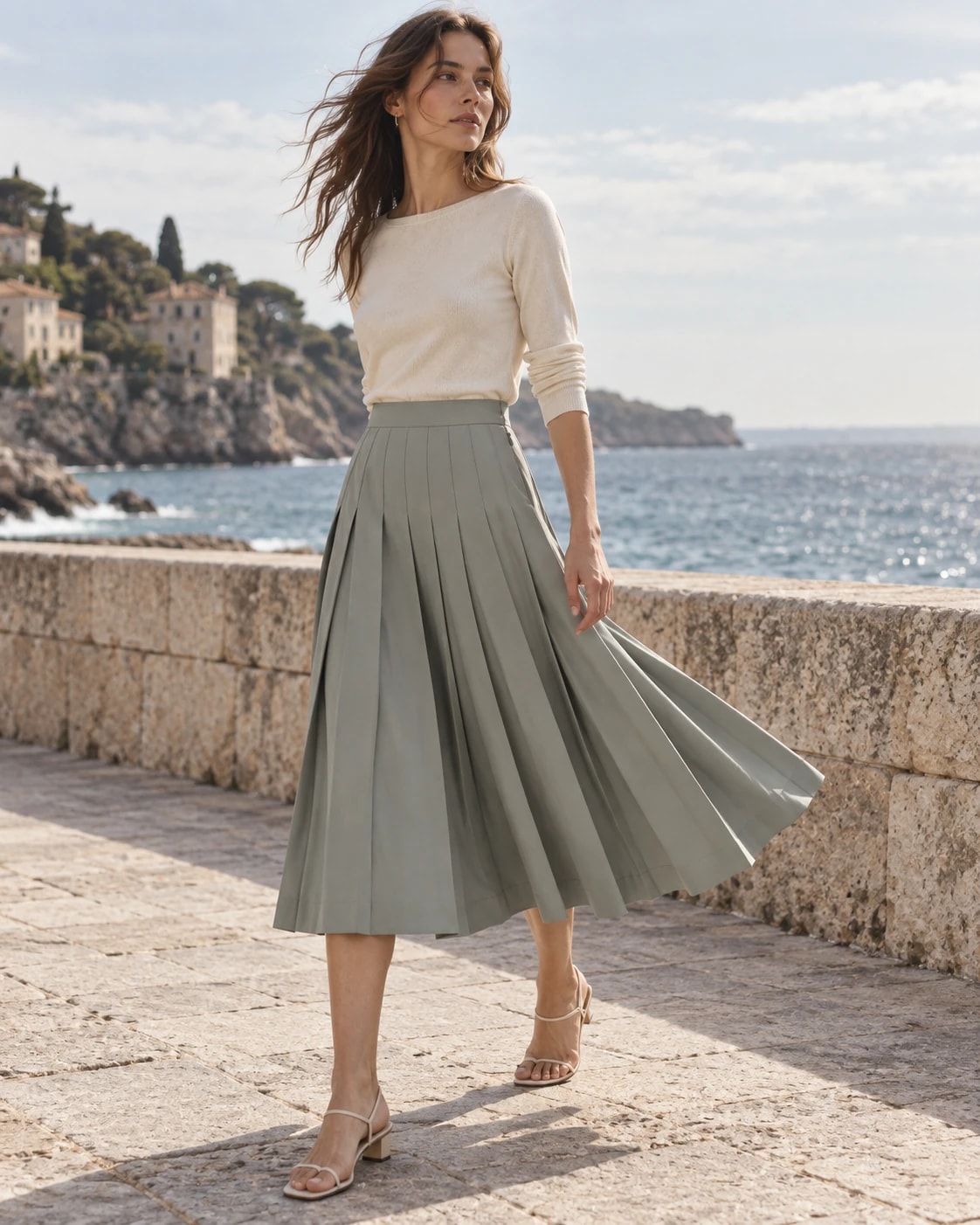 Editorial model wearing or carrying Sage-Grey Pleated Midi Skirt from the front