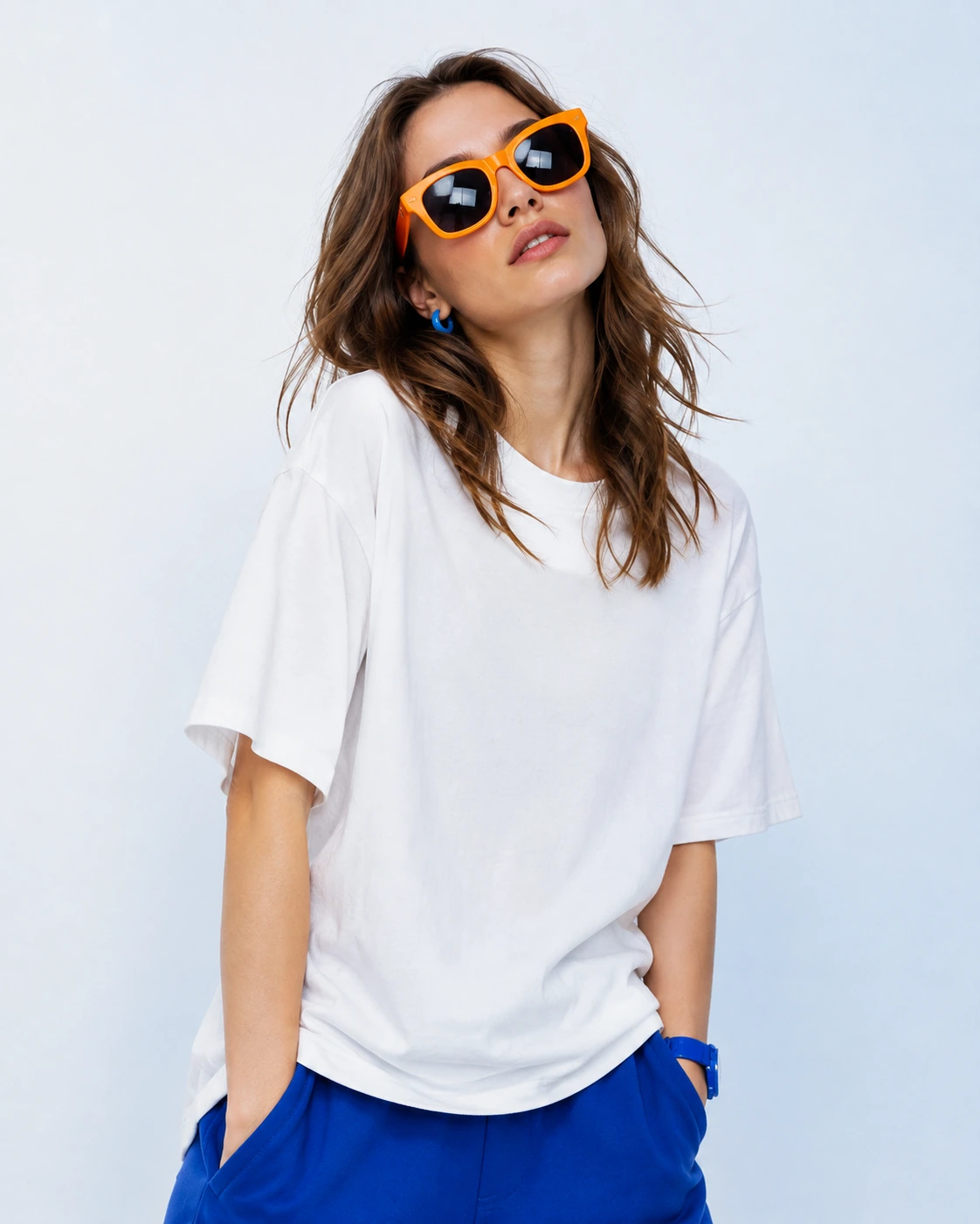 Fashion creator in white wearing orange sunglasses